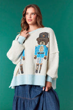 Load image into Gallery viewer, Sequin Nutcracker Bear- pastel blue ribbed hem cream oversized christmas sweater
