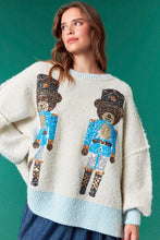 Load image into Gallery viewer, Sequin Nutcracker Bear- pastel blue ribbed hem cream oversized christmas sweater
