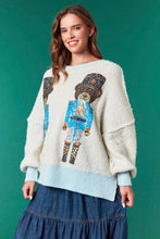 Load image into Gallery viewer, Sequin Nutcracker Bear- pastel blue ribbed hem cream oversized christmas sweater

