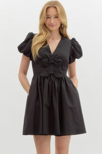 LOLA- Black Solid v-neck short puff bubble sleeve fit-and-flare dress featuring oversized bow details